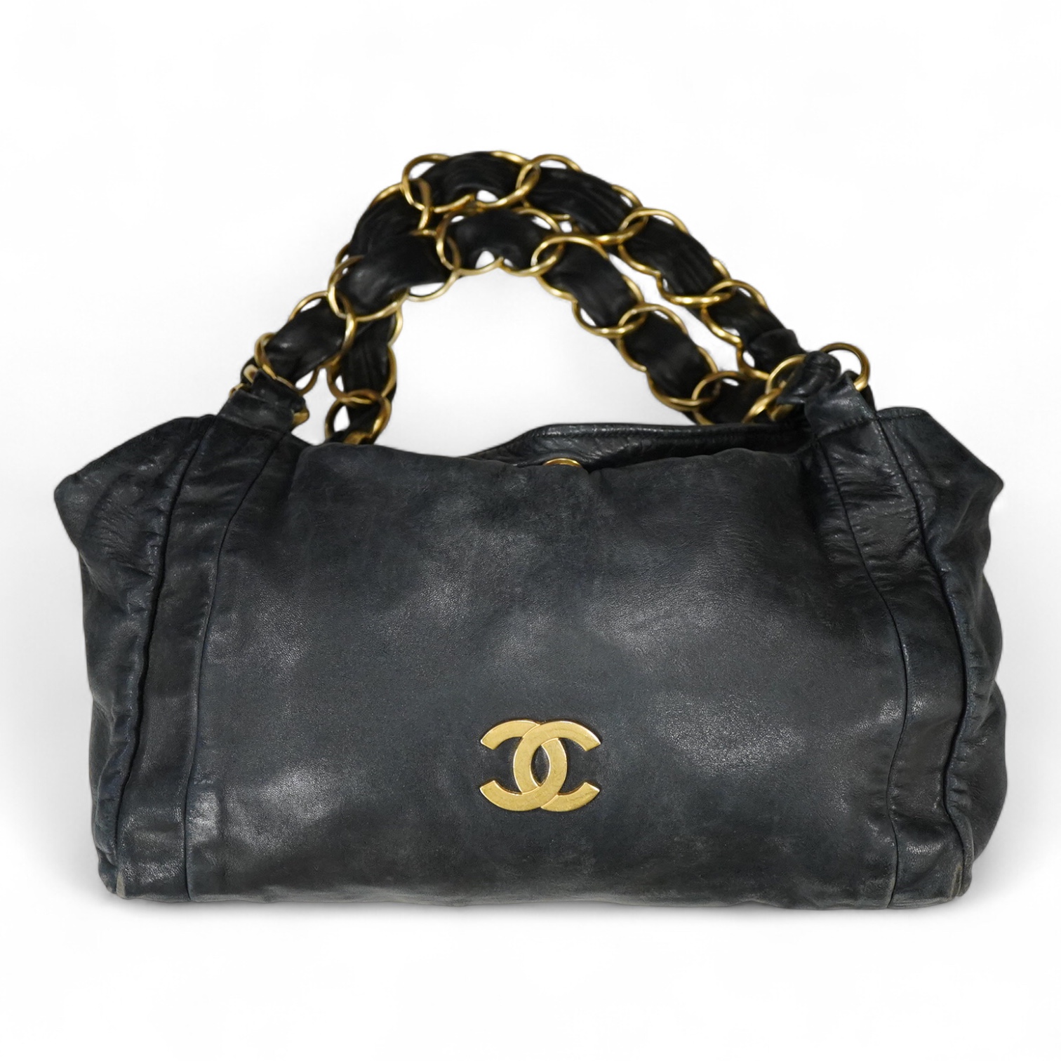 An early 2000’s Chanel black leather handbag with gold hardware, date code 7949937, 31cm wide